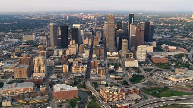 Wide orbit of downtown Houston and freeway interchanges in foreground. Shot in 2007.