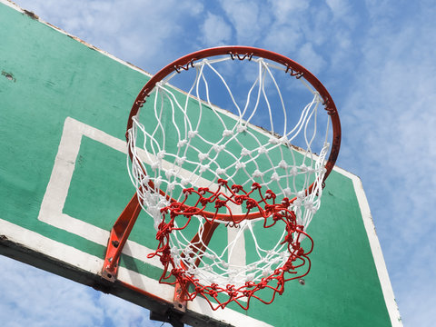 Street basketball, Wooden basket hoop on blue sky, Close up image