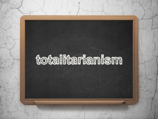 Political concept: Totalitarianism on chalkboard background
