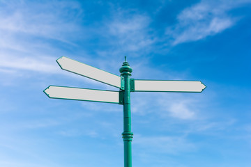 Blank Road Sign on Blurry Blue Sky And White Clouds Background with Clipping Path