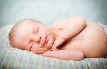 Little newborn baby boy 14 days, sleeps