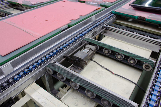 Electric motor and conveyor belt in factory