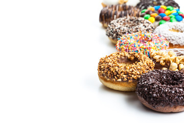 various donuts on white background