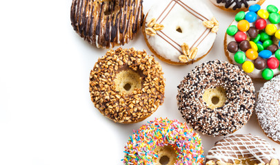 Delicious donuts with icing isolated on white