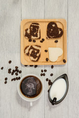 top view of  coffee and heart shape bread