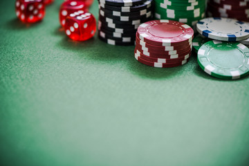 green poker table with chips, selective focus