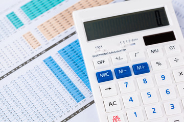 work with a magnifying glass, a calculator and papers