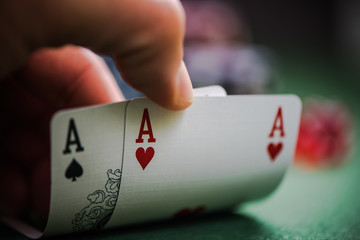 man shows two aces in poker