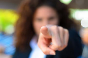 Woman pointing an accusatory finger at the camera