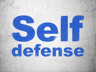 Security concept: Self Defense on wall background