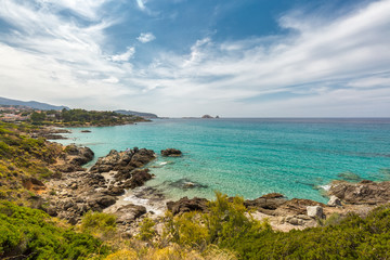 Fototapeta na wymiar Translucent sea and rocky coastline of Corsica near Ile Rousse