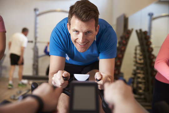 Man On Exercise Bike In A Spinning Class At A Gym, Close Up