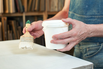 An artist priming canvas Selective focus