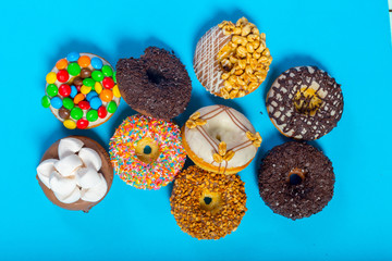 Assorted donuts on a blue background