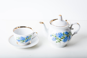 Cup of tea with teapot in vintage style