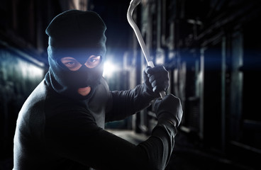 Thief holding a crowbar