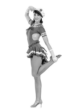 colorless portrait of young dancer woman dressed as a sailor posing on an isolated white background