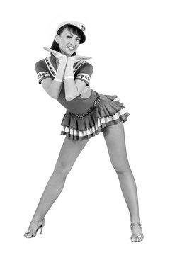 colorless portrait of young dancer woman dressed as a sailor posing on an isolated white background