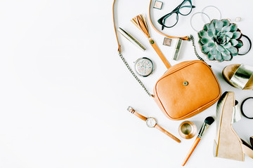 flat lay feminine clothes and accessories collage with cardigan, trousers, sunglasses, watch, bracelet, lipstick, mint high heel shoes, earrings and purse on white background.