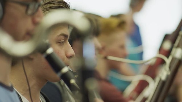 Close up of teenage boys in orchestra practice / American Fork, Utah, United States