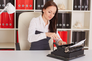 Young woman with typewriter.