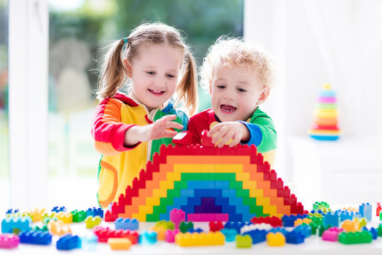 Kids Playing With Colorful Blocks