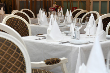 Tables in the restaurant prepared to receive guests