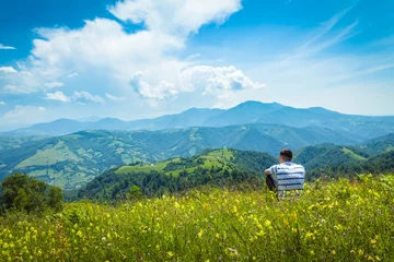 Zelfklevend Fotobehang Young man admiring rural landscape © bdavid32