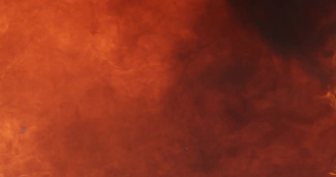 Raging flames with bits of debris fill the screen