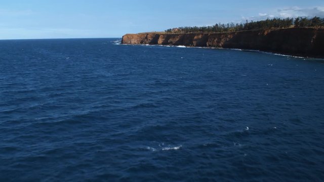 Flying past cliffs along Hawaii's North Shore