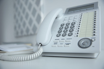 Office IP telephone on light background