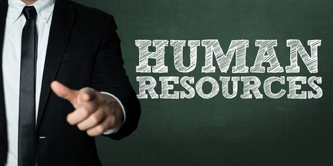 Business man pointing with the text: Human Resources