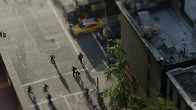 High angle wide time lapse shot of flagger directing traffic / New York, New York, United States