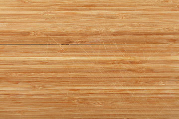 Naklejka premium Tło deska do krojenia z drewna bambusowego cięć