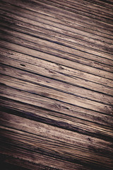Fototapeta premium Weathered boardwalk planks of wood with heavy grain and vintage tone