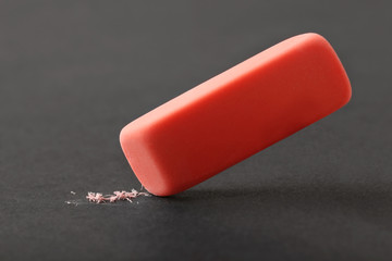 Red eraser on dark background