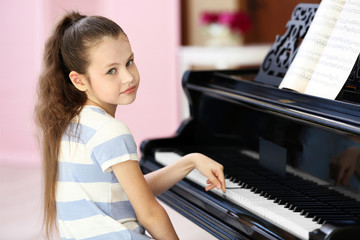 Tired girl playing piano