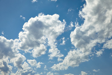 White clouds running over blue sky