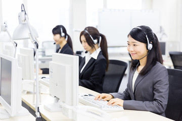 asian operator working in office