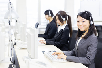 asian operator working in office