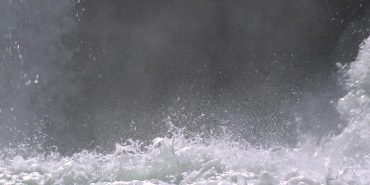 Close-up splashing whitewater at the foot of a low falls