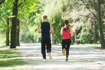 Young Couple Jogging In Park