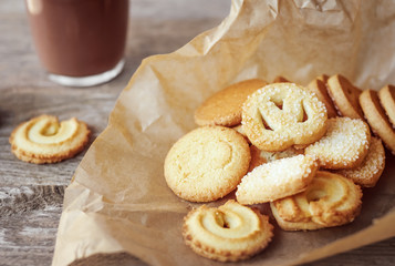  Butter cookies closeup  on Rustic Wooden Background with a cup