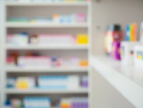 Close up of medicine bottles on shelves of drugs in the pharmacy