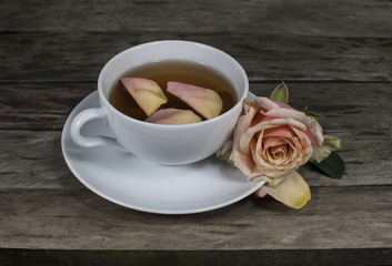 Cup of tea on vintage wooden board