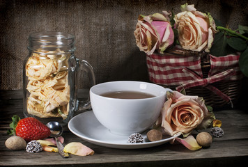 Cup of tea on vintage wooden board