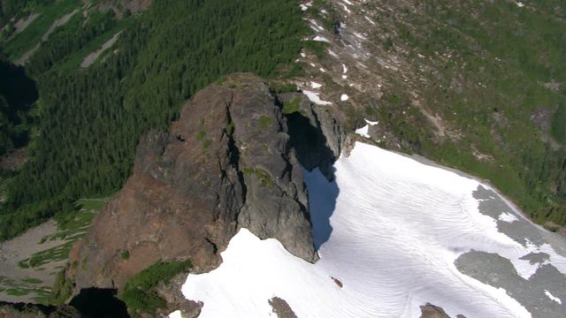 Flight over timbered ridge in Canadian Cascades, British Columbia