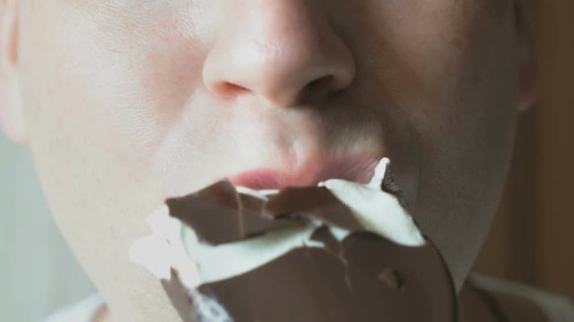 Man eating a chocolate ice-cream