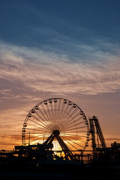 Ferris Wheel and roller coaster silhouette at sunset. Taken in Wildwood, New Jersey