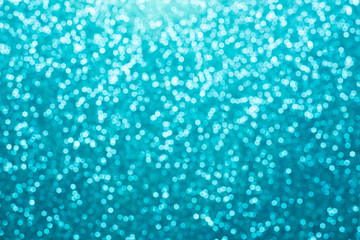 Fototapeta na wymiar Festive blur blue glitter bokeh background